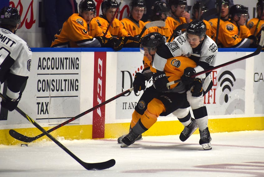 Cape Breton Eagles forward Émile Hegarty-Aubin, left, skates with the puck in the neutral zone as he ties up with Anri Ravinskis of the Blainville-Boisbriand Armada during Quebec Major Junior Hockey League action at Centre 200 on Friday. The Armada won the game 7-1. JEREMY FRASER/CAPE BRETON POST