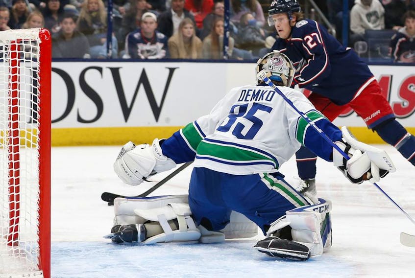 Columbus Blue Jackets' Adam Boqvist gets set to shoot against Vancouver Canucks goalie Thatcher Demko during second-period NHL action on Nov. 26 in Columbus, Ohio.