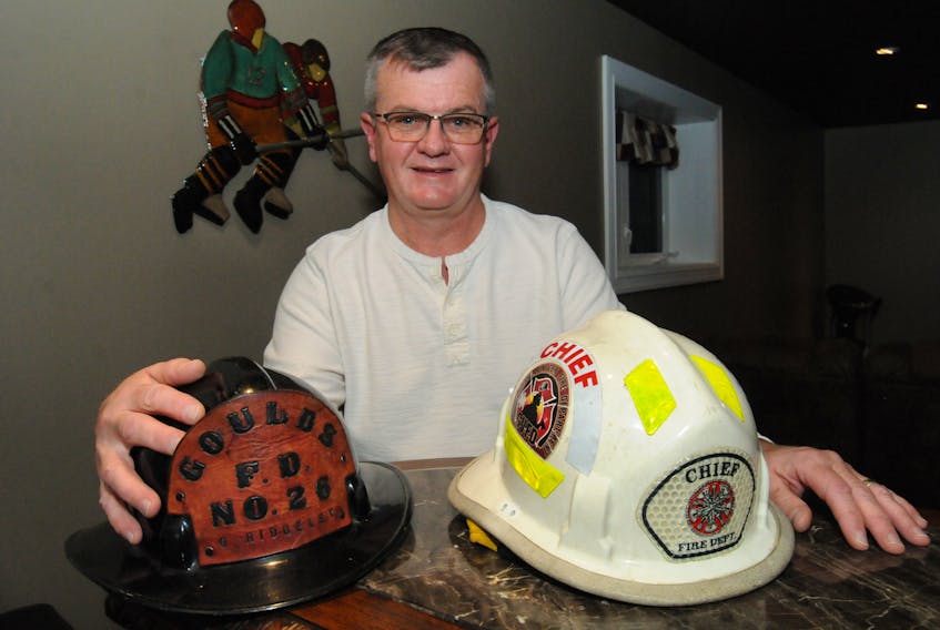 St. John’s Ward 5 Coun. Carl Ridgeley at his home in the Goulds on Nov. 25, in his rec room with his and his father’s firefighter helmets. Both were members of the Goulds Volunteer Fire Department.
- Joe Gibbons/The Telegram