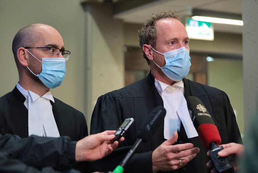 Crown attorney Rick Woodburn, right, speaks with reporters Monday while colleague Scott Morrison looks on after a Nova Scotia Supreme Court judge delivered verdicts for 13 of the 15 men charged in the December 2019 beating of an inmate at the Dartmouth jail. Justice Jamie Campbell convicted 12 men of aggravated assault and one of obstructing correctional officers. 
ERIC WYNNE/Chronicle Herald