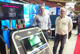 Notus marketing manager Francis Parrott (left) and founder Brad Henderson (right) were at the Boat and Marine Show in St. John's on Nov. 19 to show fishing captains their latest underwater sensor technology.