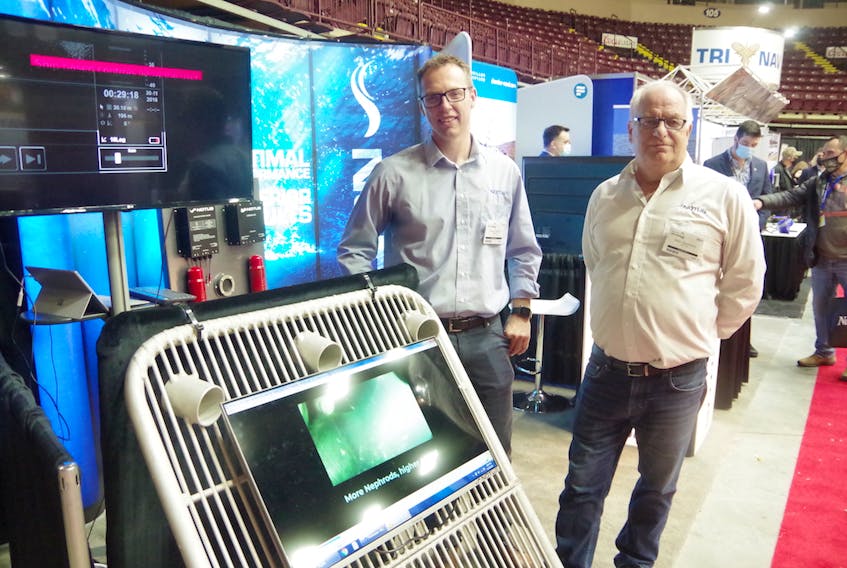 Notus marketing manager Francis Parrott (left) and founder Brad Henderson (right) were at the Boat and Marine Show in St. John's on Nov. 19 to show fishing captains their latest underwater sensor technology.