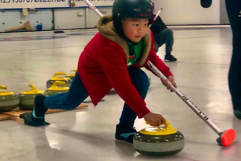 Hendrix Lau throws a rock during the Novice Rockers program practice with the Summerside Curling Club at the Silver Fox on Nov. 24.