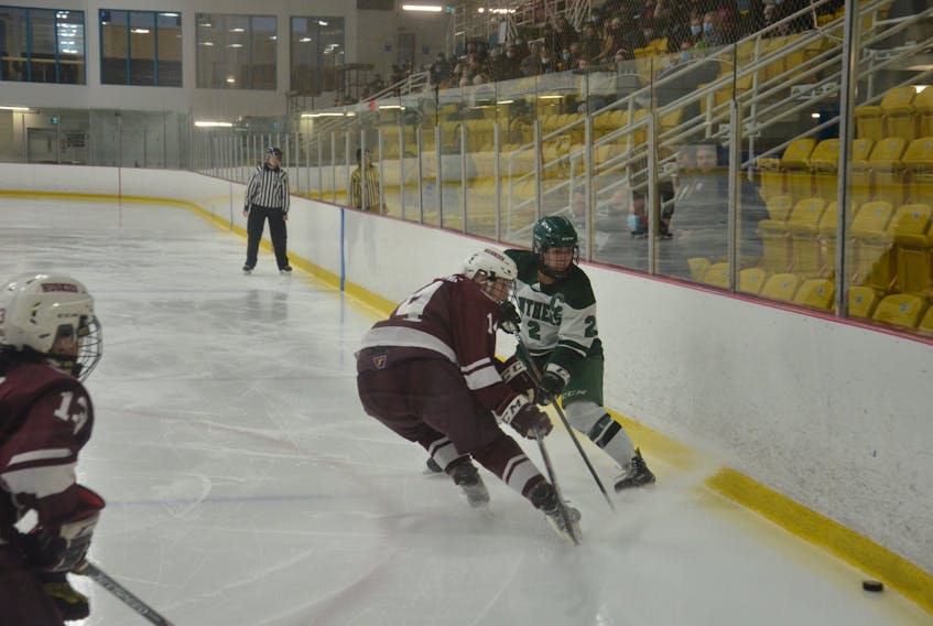 UPEI Panthers captain Sophie Vandale, 2, and the Saint Mary’s Huskies’ Taylor Keeping, 14, race for a loose puck during the first period of an Atlantic University Sport Women’s Hockey Conference game in Charlottetown on Nov. 28. The Panthers recorded a 4-2 come-from-behind win over the Huskies, the top-ranked team in last week’s USPORTS national rankings. 


