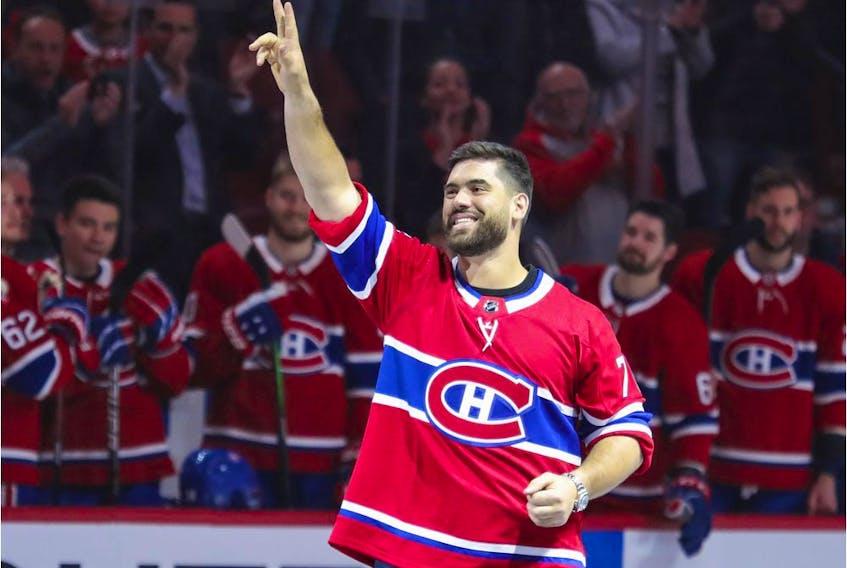 Super Bowl-winning Kansas City Chiefs offensive lineman Laurent Duvernay-Tardif waves to the crowd before a Canadiens game against the Arizona Coyotes in Montreal on Feb. 10, 2020.