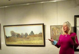 Heather Hemming speaks about her late husband George Walford’s work at the opening of a new show recently at the Harvest Gallery in Wolfville. The show, George Walford: A Retrospective, is on until Nov. 21.
