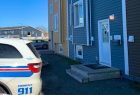 A front-door window is visibly damaged at a home in Buckmaster's Circle. Royal Newfoundland Constabulary officers were in the area Wednesday afternoon to investigate an overnight shooting in the St. John's neighbourhood.