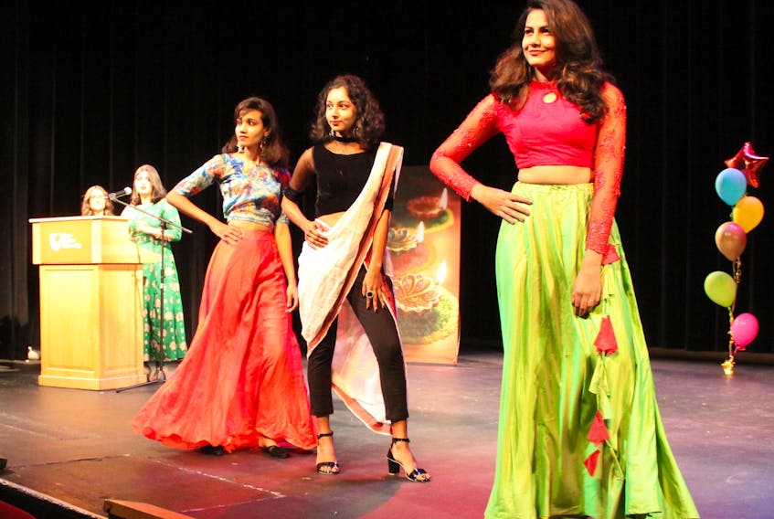Three models showcase Indian traditional looks from different regions of the country during the Diwali fashion show at Cape Breton University on Tuesday. NICOLE SULLIVAN/CAPE BRETON POST 