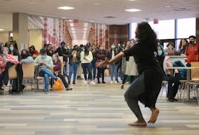 A dancer with Caper Bhangra Crew performs a traditional Indian dance in CBU cafeteria on Wednesday as part of the university's Diwali celebrations. NICOLE SULLIVAN/CAPE BRETON POST 