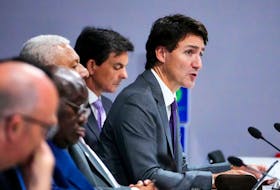 Prime Minister Justin Trudeau, right, takes part in an Oceans Panel Discussion at COP26 in Glasgow, Scotland on Nov. 2, 2021. 