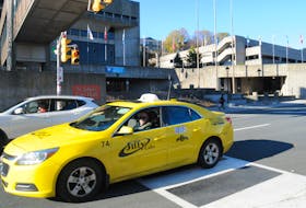 A taxi passes St. John’s City Hal on New Gower Street Wednesday afternoon, Nov. 3. Joe Gibbons/The Telegram