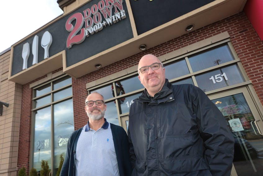 Craig Flynn, right, owner and executive chef of 2 Doors Down Food & Wine in Dartmouth and Halifax, has sold his business to George Davis, left. (For Bill Spurr story)
