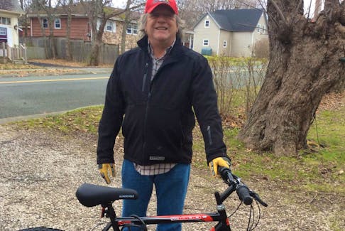 Vince Steffens of Sydney Mines with his new bike, a donation facilitated by the Salvation Army Community Church in Sydney and a member and retired member of the Cape Breton Regional Police. Steffens' bicycle was stolen Nov. 20 while he was manning a Salvation Army red kettle in Sydney Mines.