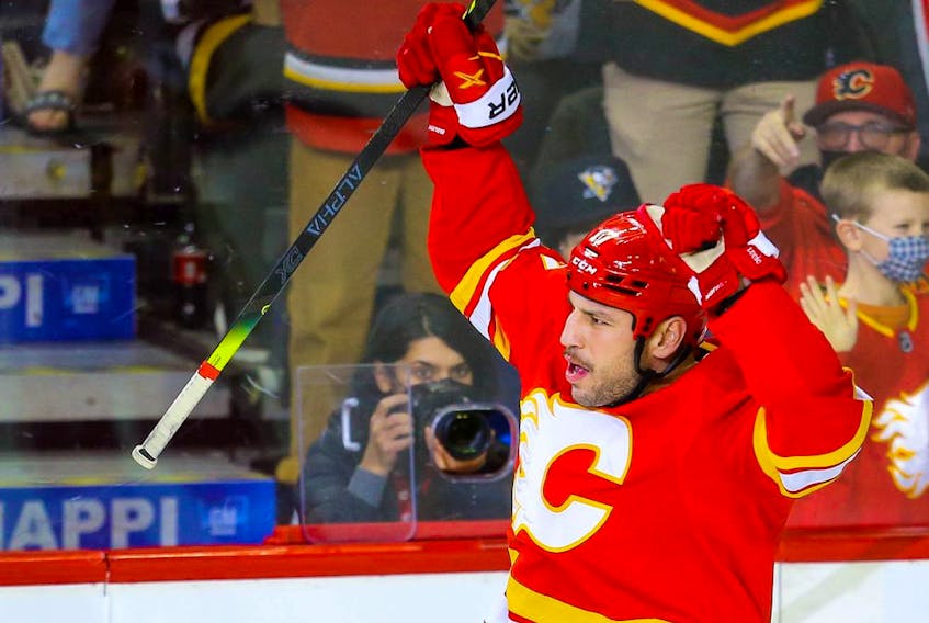  The Calgary Flames’ Milan Lucic celebrates after scoring against the Pittsburgh Penguins at the Scotiabank Saddledome in Calgary on Monday, Nov. 29, 2021.