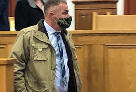 George Pottle, 46, leaves the Newfoundland and Labrador Supreme Courtroom in which Justice Donald Burrage convicted him Thursday morning of assaulting his ex-partner and causing her bodily harm. Burrage acquitted Pottle of charges of assault with a weapon and uttering threats.