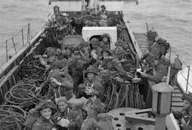 Soldiers of the Highland Light Infantry of Canada and the North Nova Scotia Highlanders aboard an LCI(L) bound for Normandy.
