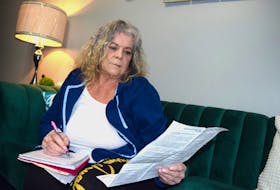 Ann Marie Racki of New Waterford with paperwork advising her of the adjustment to her guaranteed income supplement as a result of receiving CERB in 2020. Sharon Montgomery-Dupe • Cape Breton Post