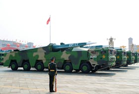 Military vehicles carrying hypersonic missiles drive through Tiananmen Square during the military parade in Beijing, China, in 2019. 