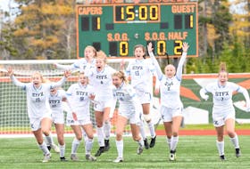 Members of the St. FX X-Women celebrate after their dramatic shootout win over the Memorial Sea-Hawks in their AUS women's soccer semifinal Friday in Sydney, N.S. — CBU photo/Vaughan Merchant