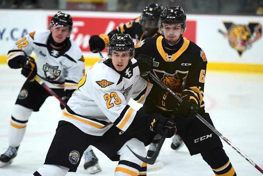Logan Camp of the Cape Breton Eagles, left, and William Cantin-Bolduc battle for position during Quebec Major Junior Hockey League action at Colisée Desjardins in Victoriaville, Que., Friday. Cape Breton won the game 3-2 in a shootout. PHOTO CONTRIBUTED/DENIS MORIN
