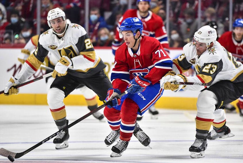 Canadiens' Jake Evans skates the puck against Alec Martinez (23) of the Vegas Golden Knights during the second period at the Bell Centre on Saturday, Nov. 6, 2021, in Montreal.