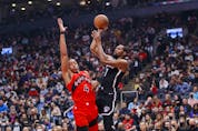  Nets’ Kevin Durant puts up a shot over Scottie Barnes of the Raptors during the first half at Scotiabank Arena on Nov. 7, 2021 in Toronto. COLE BURSTON/GETTY IMAGES