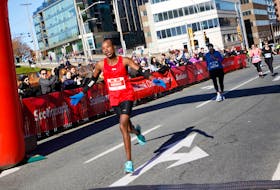 FOR MACDONALD STORY:
 Dennis Mbelenzi crosses the finish line to win the Bluenose Marathon in Halifax Sunday November 7, 2021. 
TIM KROCHAK PHOTO