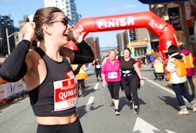 FOR MACDONALD STORY:
 Quinlan Hickey of Toronto,  reacts to being the first female finisher of the Bluenose Marathon in Halifax Sunday November 7, 2021. 
TIM KROCHAK PHOTO