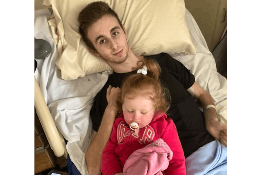 Having his children visit him in a hospital is stressful for AJ Rumbolt, who’s seen here with his daughter Haven at the Miller Centre in St. John’s in May. Rumbolt is waiting on Newfoundland and Labrador Housing to arrange for repairs and renovations to a home in Port au Choix in which he will live.