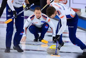  Skip Brad Gushue delivers a rock while facing Bruce Mouat’s team during the final of the BOOST National at the Chestermere Community Recreation Centre onSunday, Nov. 7, 2021.