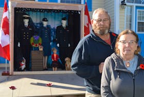 Dan Miller, left, and his wife, Phyllis, have created a large Remembrance Day tribute display that sits in from of their home on Upton Road in Charlottetown. Both of the Millers are veterans.