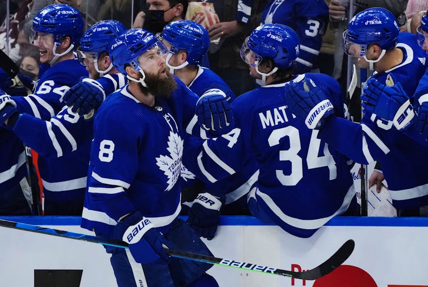 Toronto Maple Leafs defenceman Jake Muzzin (8) celebrates his goal against the Detroit Red Wings during first period NHL hockey action in Toronto on Saturday, October 30, 2021. 