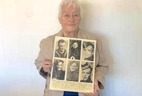 Louvine Kemp holds a photograph from a 1944 copy of the Cape Breton Post of her father, grandfather and four uncles, who all served together during the Second World War. Chris Connors • Cape Breton Post