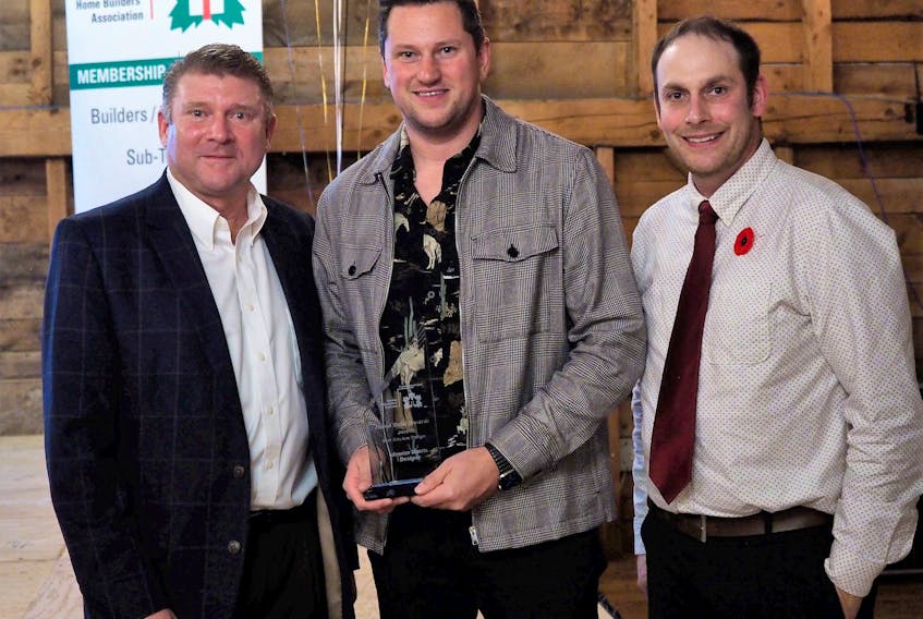 Damien Packwood, the owner of damien Morris Designs, middle, was presented the award for Best Kitchen Design by the CEO of Atlantic Home Warranty, Ian Lezama, left and CHBA-PEI President and owner of Ravenwood Stairways, Andrew Garth, during the Island Build Awards on Nov. 5.