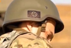 File photo: A news broadcast by German ZDF station showed soldiers of the Ukraine Azov Battalion with nazi symbols on their helmets.