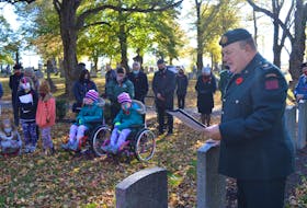 Rev. Maj. Tom Hamilton says a prayer during the No Stone Left Alone remembrance ceremony held Nov. 2 at the Sherwood Cemetery in Charlottetown. The Grade 4 class at Eliot River Elementary School took part, laying a wreath as well as poppies at the gravestone of each veteran. 