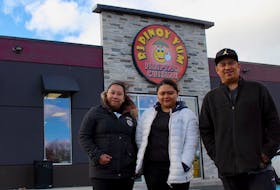 Front of house supervisors and cousins Angelyn Dimal (left) and Gianahlene Jungco (centre) stand outside the new location of RJ Pinoy Yum on Cashin Avenue with their uncle and chef Ricky Dela Cruz (right), who has owned and operated the restaurant with his wife Jocelyn for the past six years. Formally located on Ropewalk Lane, the new location has room for more diners, but customers can expect the same family-friendly service, atmosphere and dishes, Dimal and Jungco said. They are hoping to open the doors of their new location to the public on November 15, their sixth anniversary.