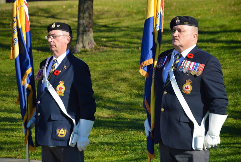Honour guard members David Keeping, left, and Stephen MacLennan were part of an abbreviated Remembrance Day ceremony at the Ashby corner cenotaph in Sydney due to the pandemic last year. The service on Thursday in Sydney will once again take place at Veterans Memorial Park at Ashby corner. DAVID JALA/CAPE BRETON POST