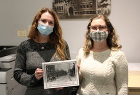 Colchester Historeum archives staff Ashley Sutherland and Alyssa Giles with the calendar for the museum's fundraiser.