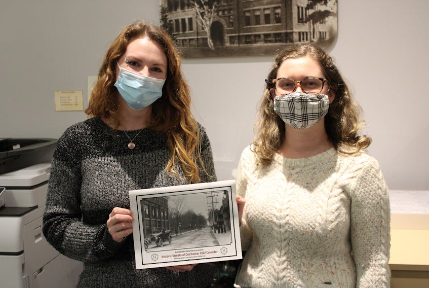 Colchester Historeum archives staff Ashley Sutherland and Alyssa Giles with the calendar for the museum's fundraiser.