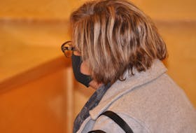 Melissa Williams kept her head turned from view when she appeared in provincial court in Corner Brook on Wednesday, Dec. 1. Williams changed her plea to guilty on two charges related to defrauding the Corner Brook Minor Hockey Association and four other charges were conditionally withdrawn.