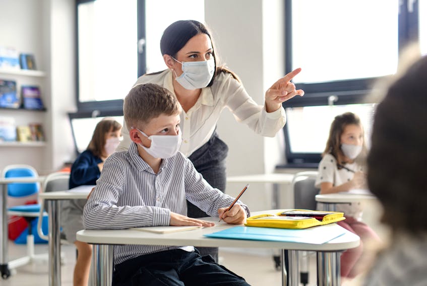 A Teacher in the classroom during the pandemic.