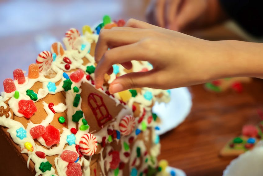 Tracing its roots to the fictional story of Hansel and Gretel in the 1800s, building a gingerbread house remains a popular holiday tradition for many families. - UNSPLASH