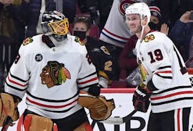 Chicago Blackhawks goalie Marc-Andre Fleury (left) and forward Jonathan Toews (right) celebrate the team's win against the Montreal Canadiens at the Bell Centre on Dec 9, 2021. The win was Fleury's 500th NHL victory. 
