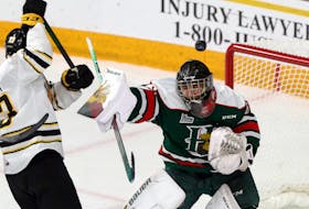 Dec. 11, 2021--As the puck flies over the top of the net Halifax Mooseheads' goaltender Mathis Rousseau guards against the play from Victoriaville Tigres' Maxime Pellerin late in the first period.
ERIC WYNNE/Chronicle Herald