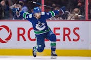  Canucks’ Conor Garland celebrates his goal against the Winnipeg Jets during the second period at Rogers Arena in Vancouver. The Canucks prevailed 4-3 in the shootout.