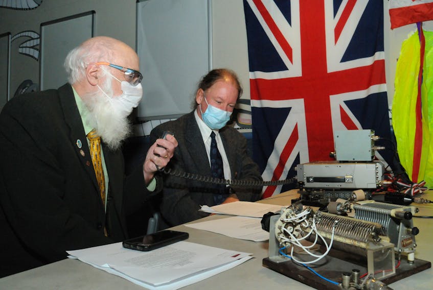 Len Zedel (left) and Joe Craig speak Sunday, Dec. 12, with Poldhu Amateur Radio Club members in Cornwall, England. JOE GIBBONS • THE TELEGRAM
