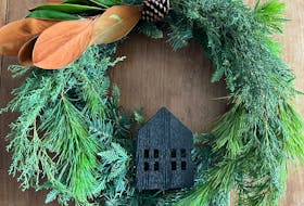 Kathryn Flynn recommends getting a plain wreath from any store and then embellishing it to your taste with ribbons, bows, or bottle brush trees. 