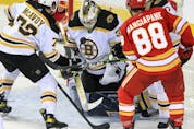 Boston Bruins goaltender Linus Ullmark makes a save against the Calgary Flames at Scotiabank Saddledome on Saturday, Dec. 11, 2021. 