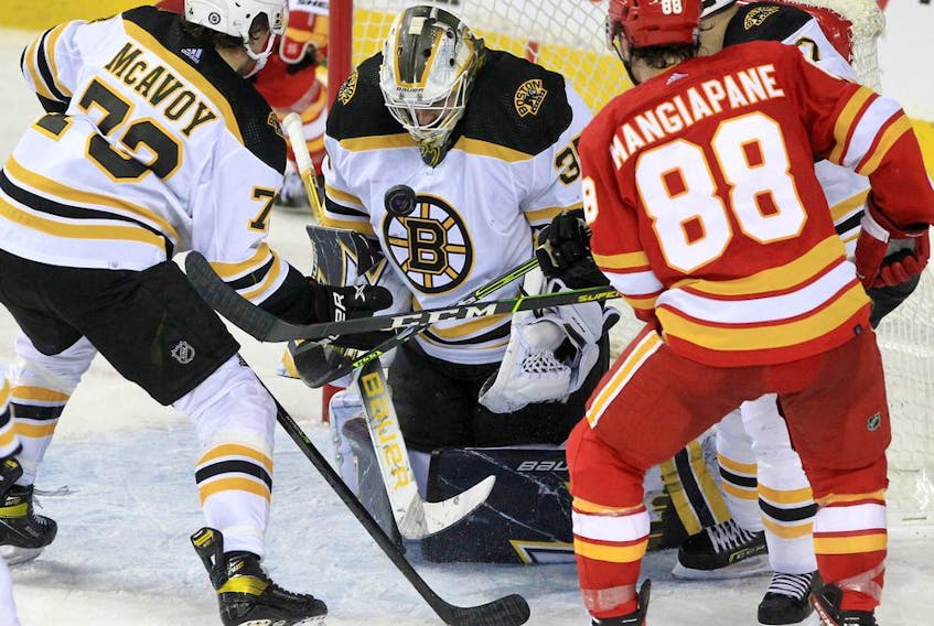 Boston Bruins goaltender Linus Ullmark makes a save against the Calgary Flames at Scotiabank Saddledome on Saturday, Dec. 11, 2021. 